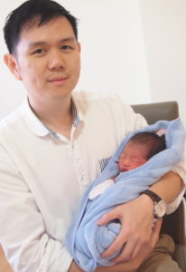 Dr Chong holding baby